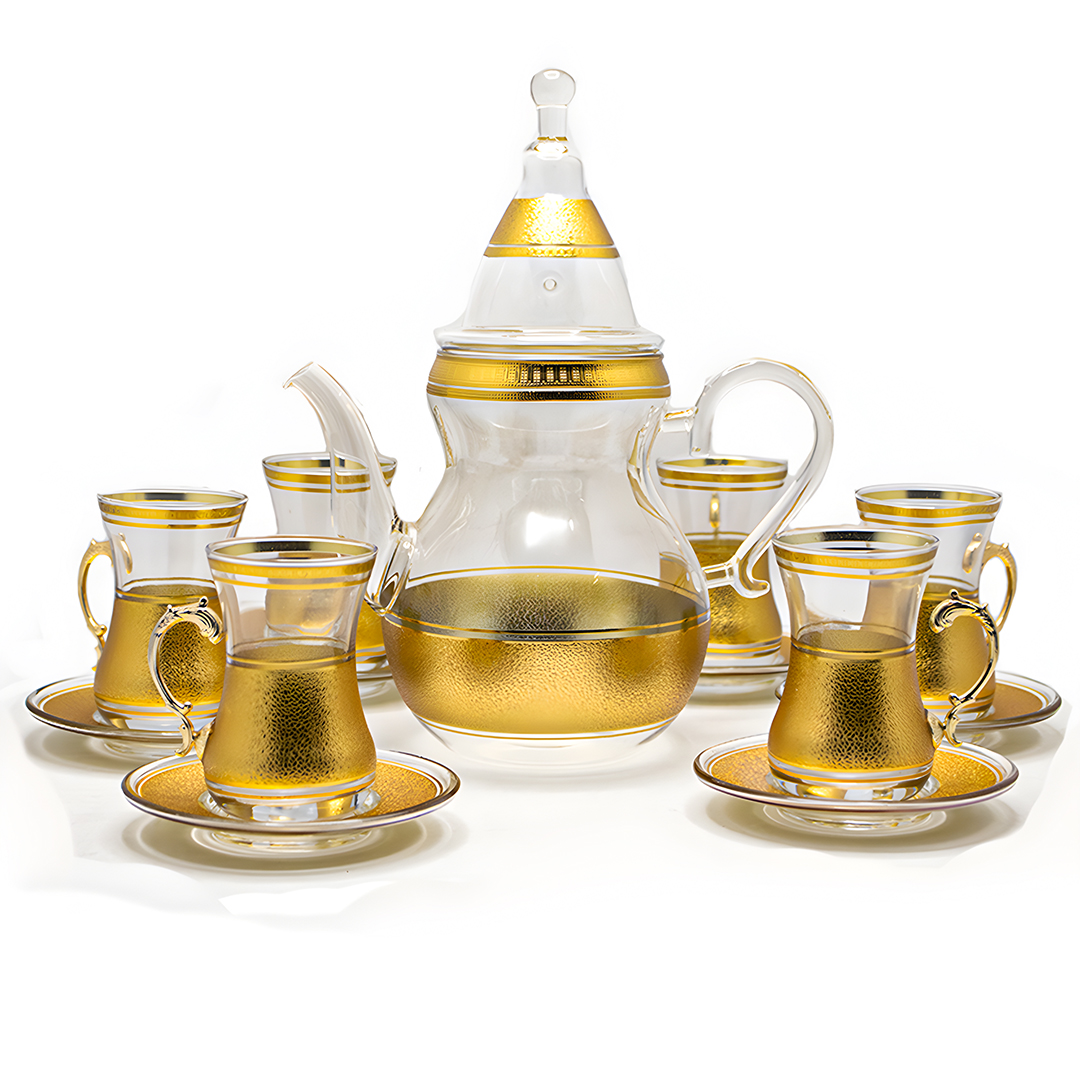 Arabic tea set with luxurious teapot and gold cups and saucers