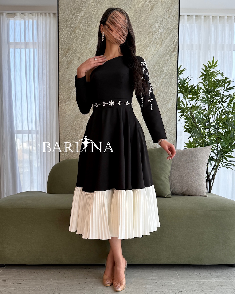 Black one shoulder dress with white pleats