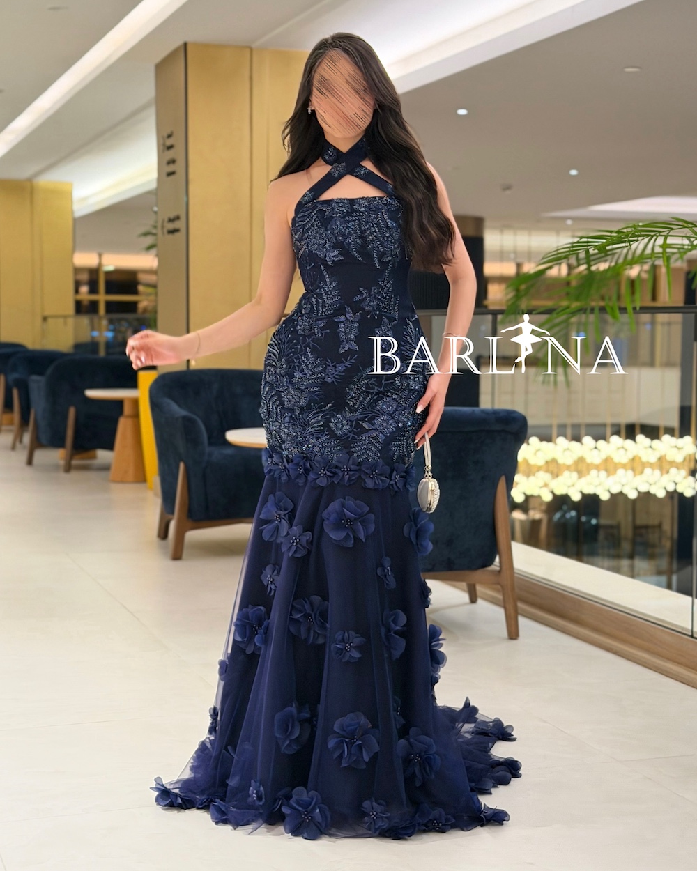 Luxurious navy blue evening dress with a cross-neck