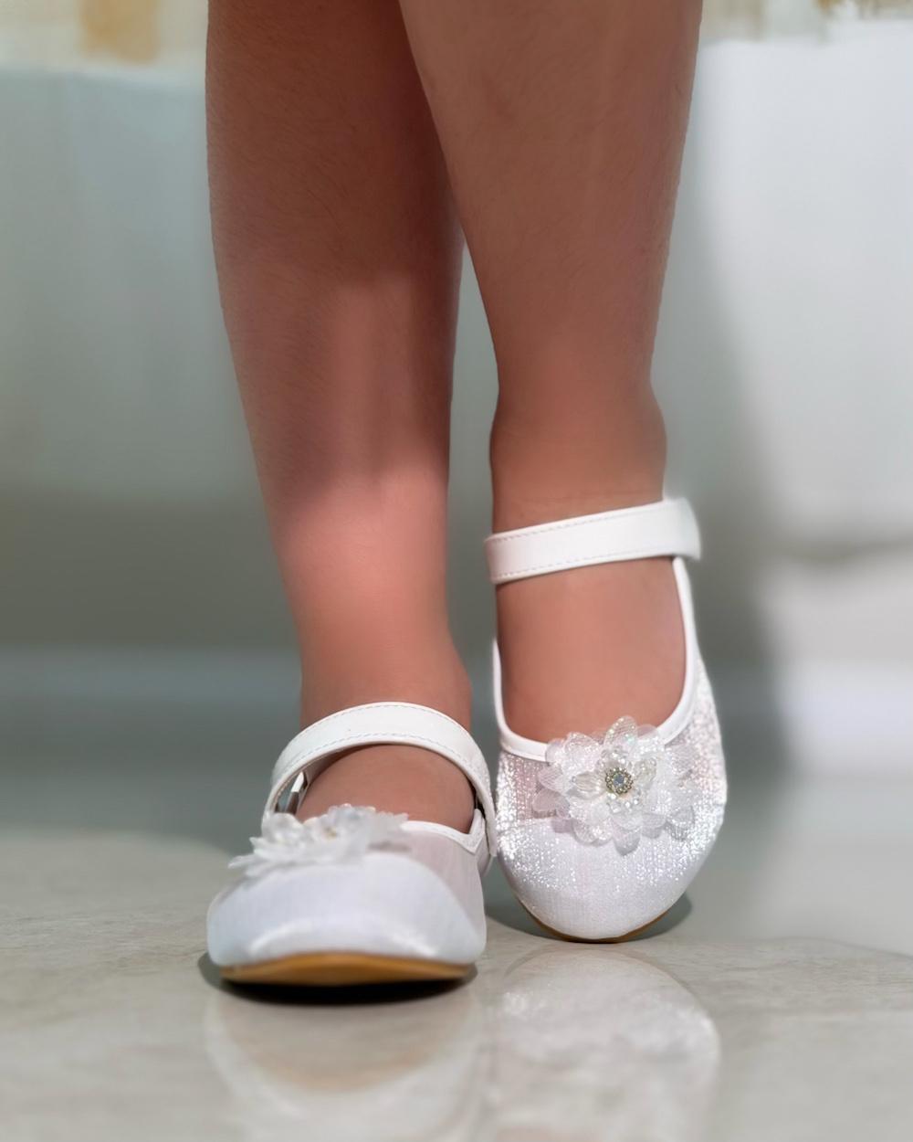 Girls' shoes with delicate details and a subtle sheen