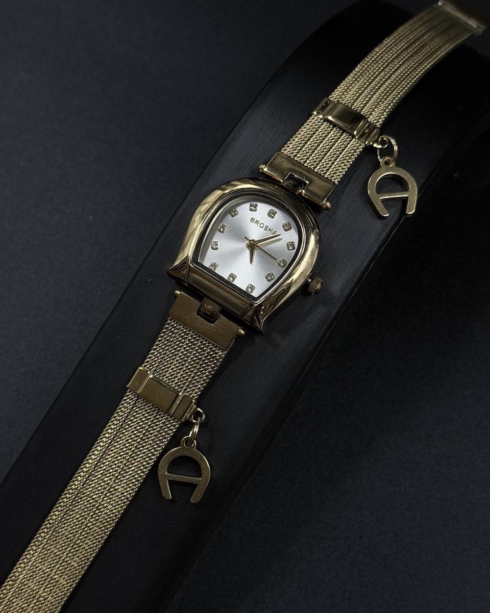 Elegant women's watch adorned with a charm
