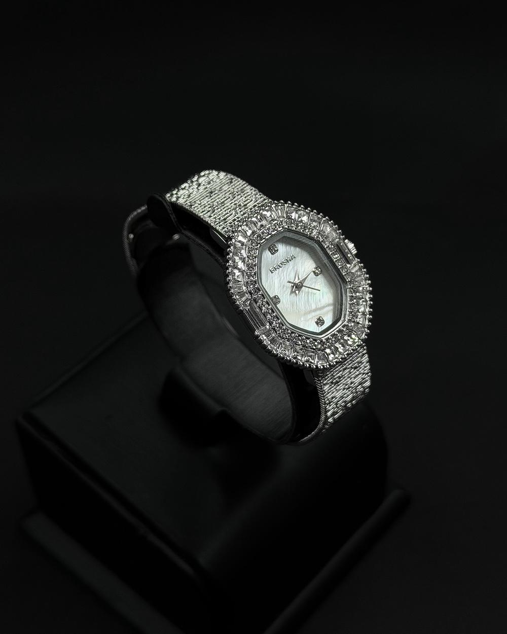 Womens watch with an oval bezel fully studded
