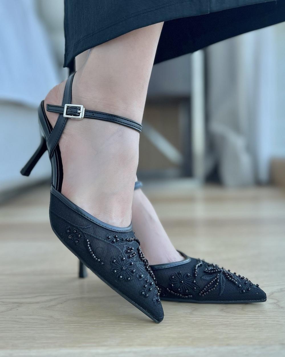 Elegant transparent women's heel with a thin strap