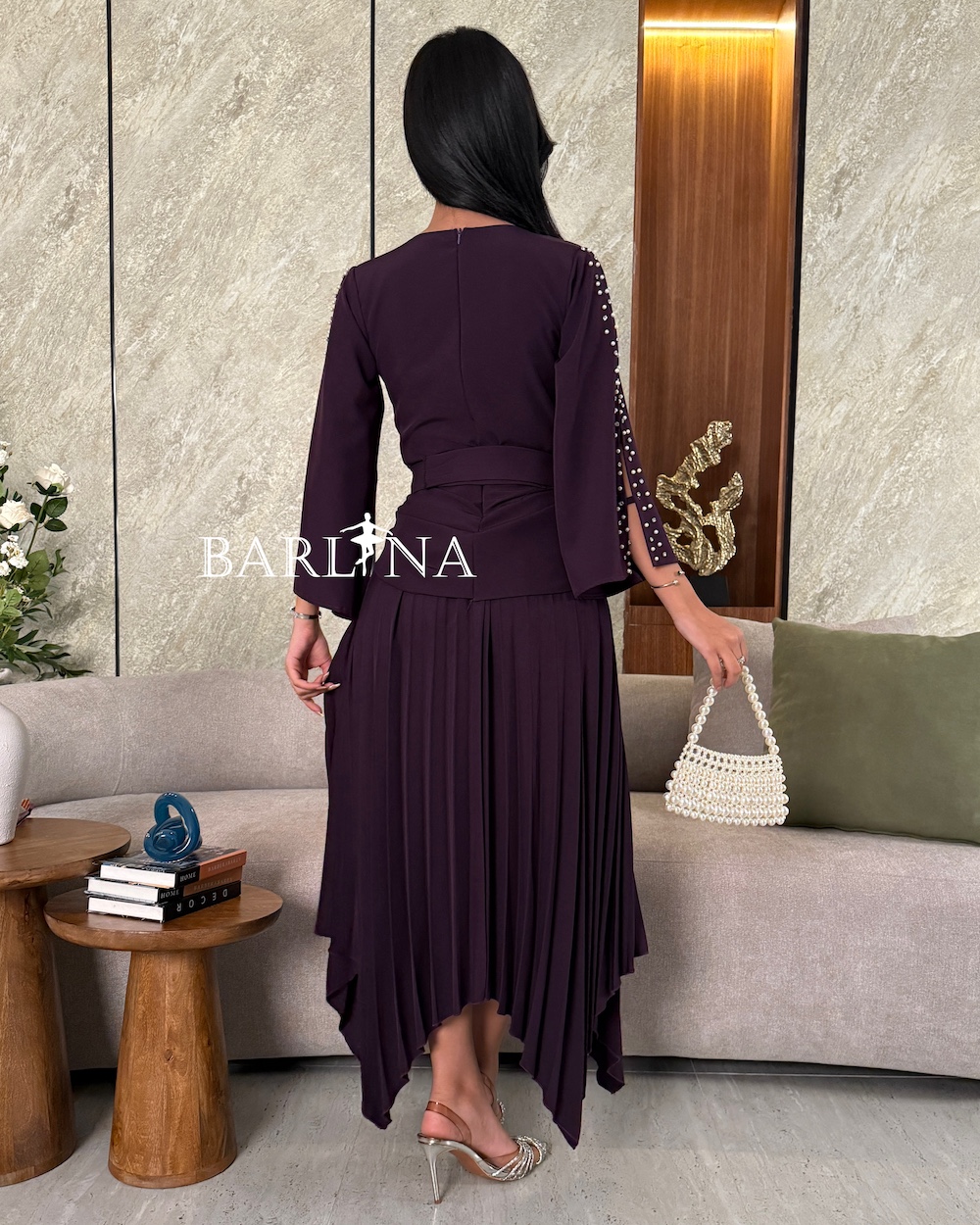 Dark purple dress with pearl embellished sleeves