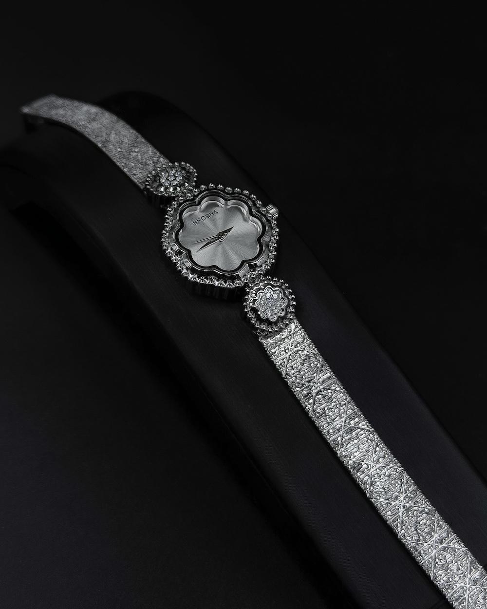 A delicate women's watch with an elegant floral design