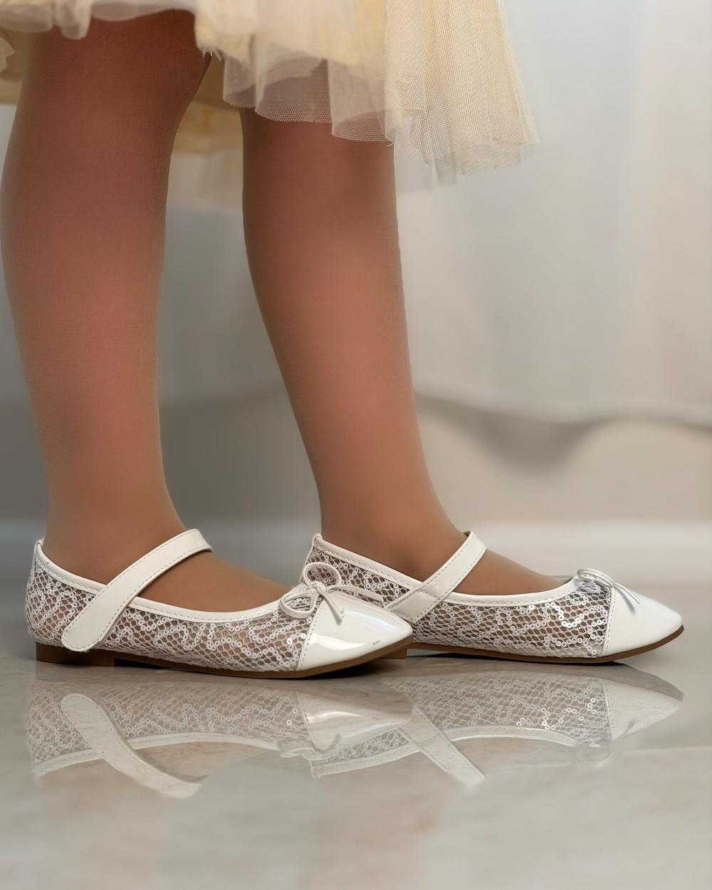Girls' shoes with a front strap and a lace-up detail