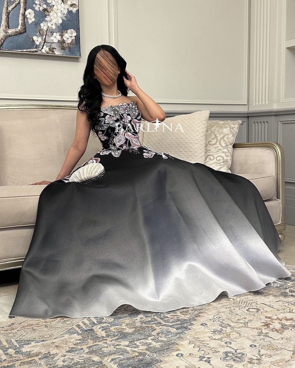 Black gradient dress with floral embellishment