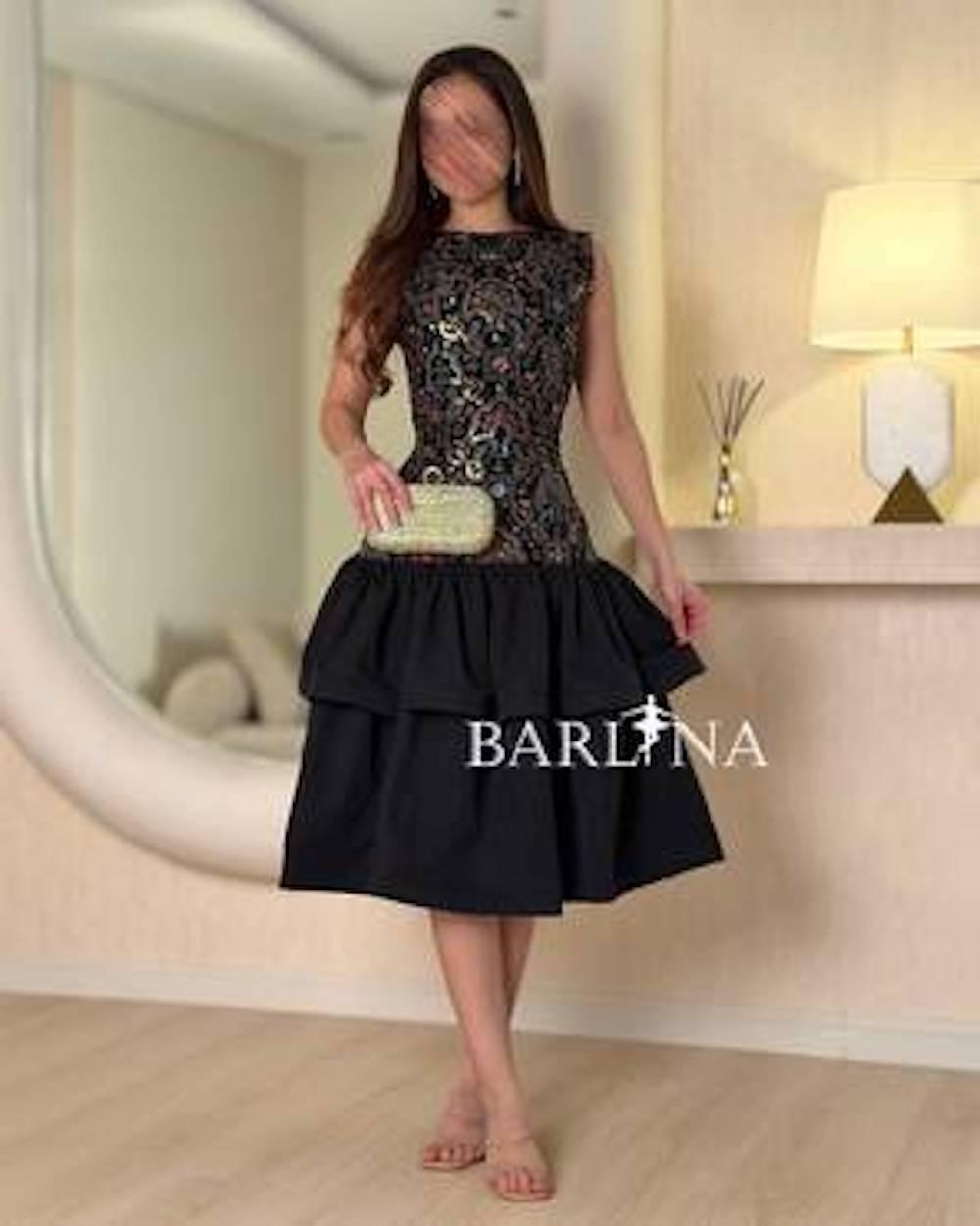 A soft dress with layers and embroidery on the top