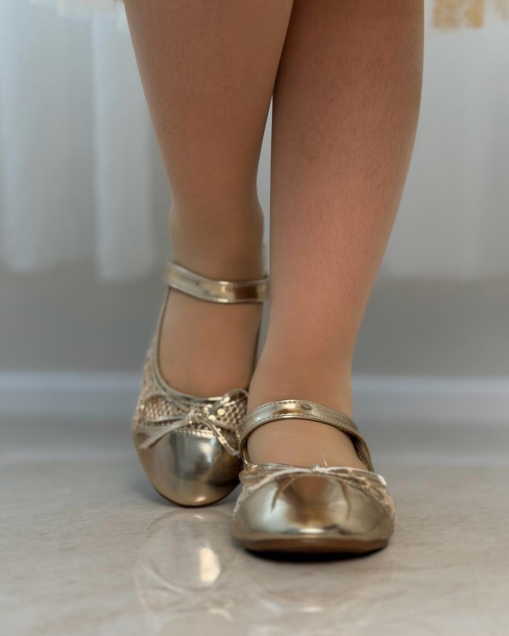 Girls' shoes with a front strap and a lace-up detail