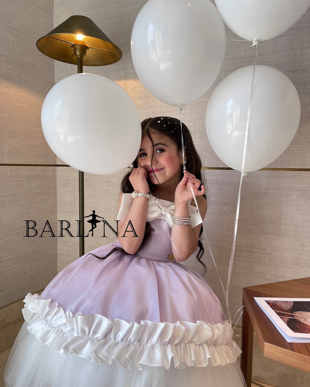 Girls' mauve dress with an elegant white bow