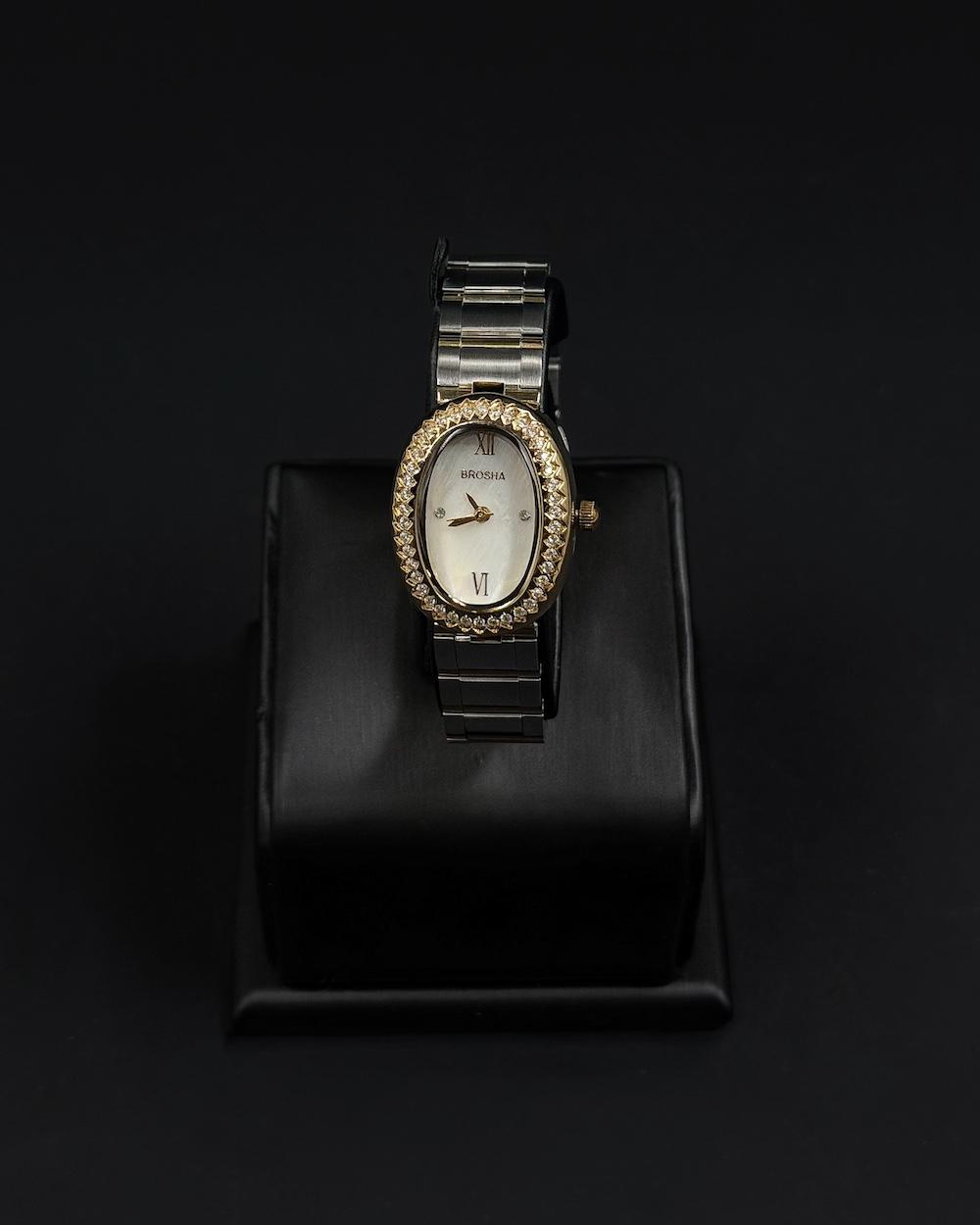 An oval-shaped watch surrounded by crystal