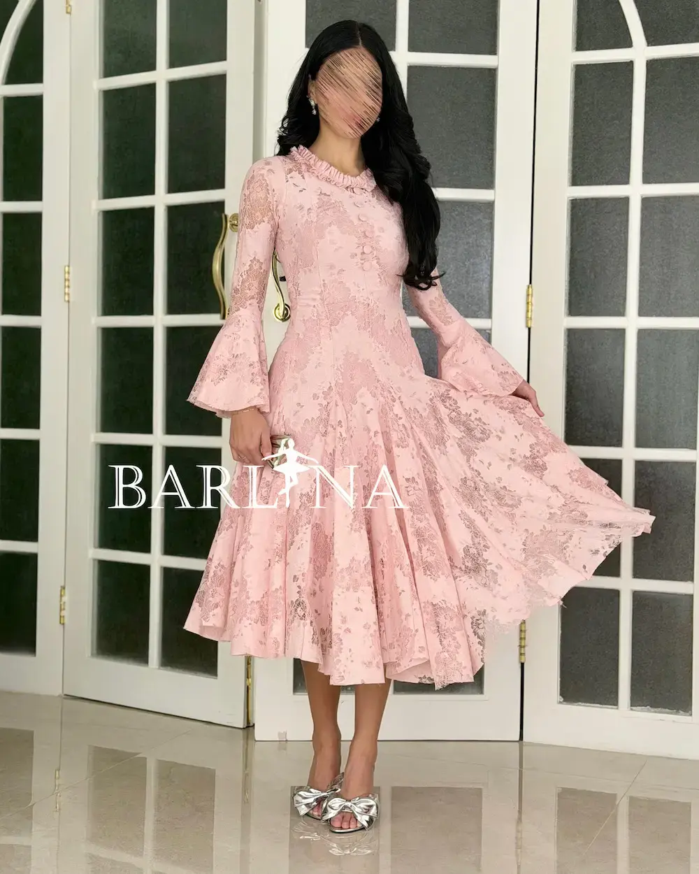 A soft dress adorned with elegant lace patterns