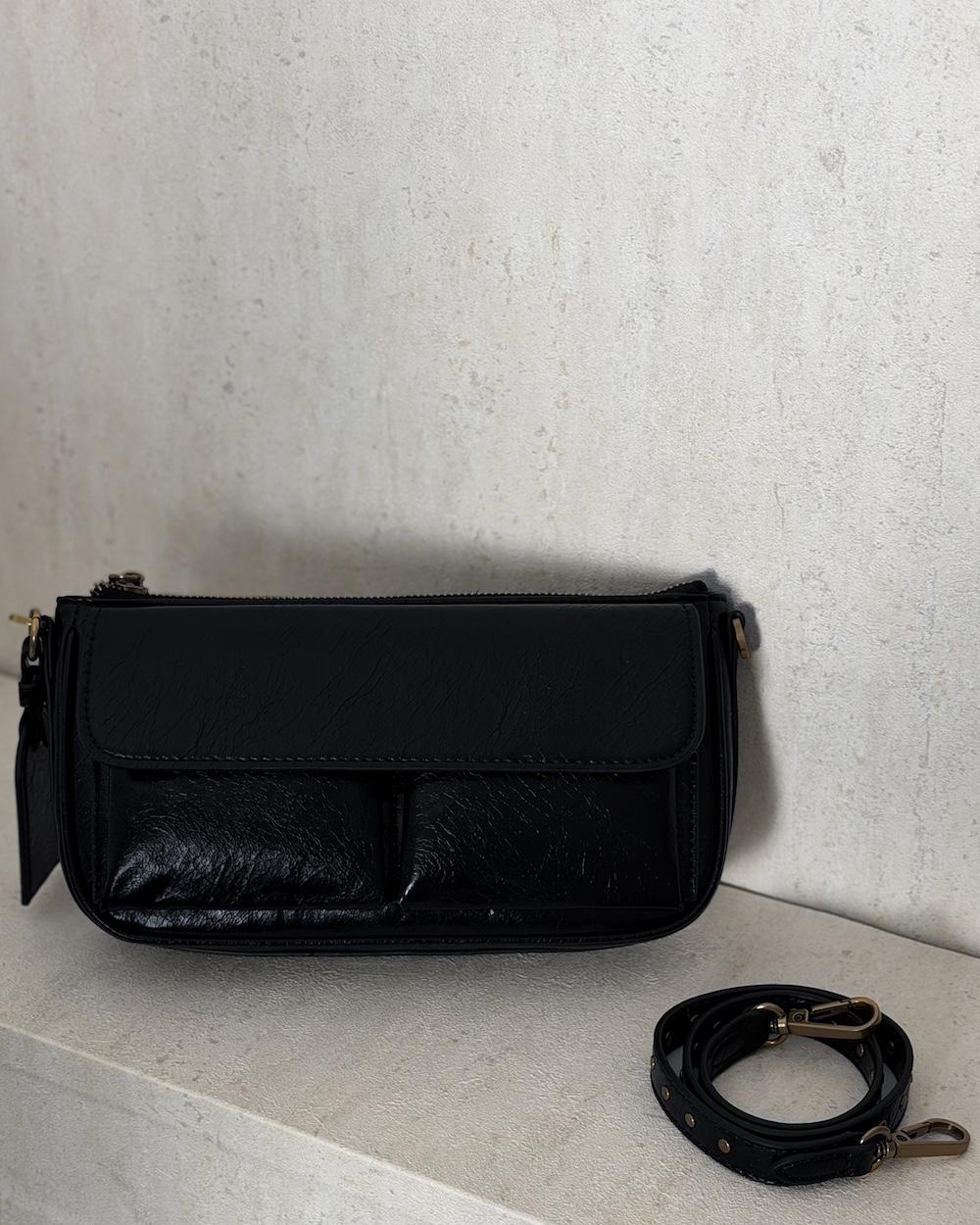 A soft handbag with a practical design and front pockets.
