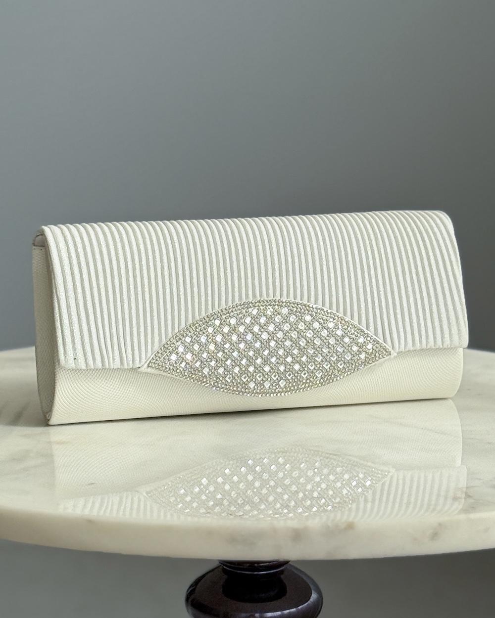 A bag decorated with a front panel made of rhinestones