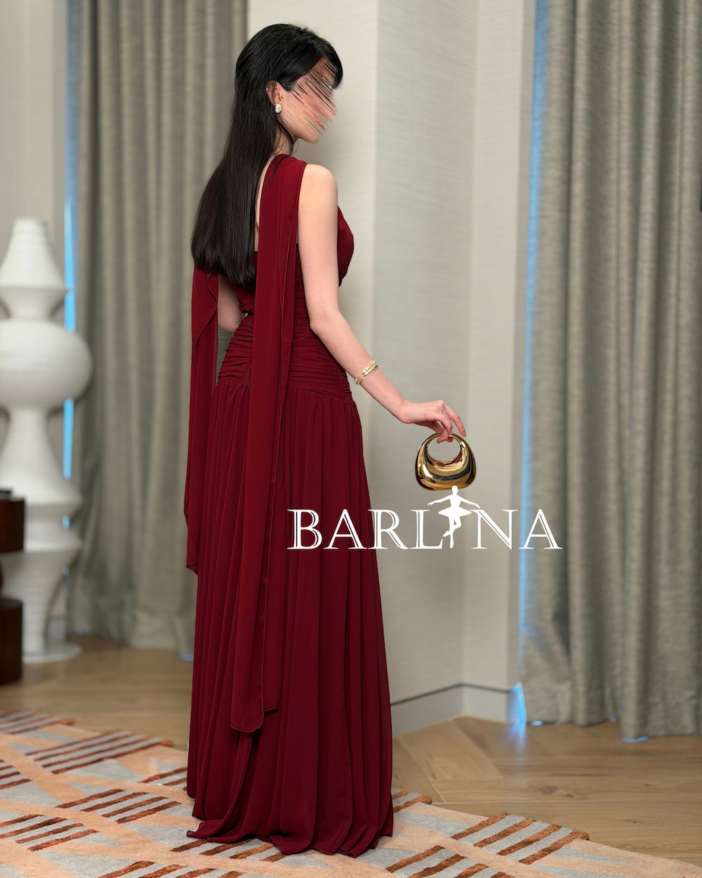 Burgundy dress with soft pleats and halter neck design