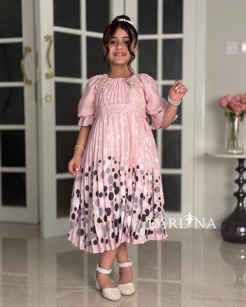Girls' pink dress with elegant polka dot details