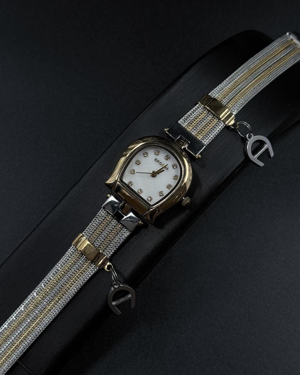 Elegant women's watch adorned with a charm