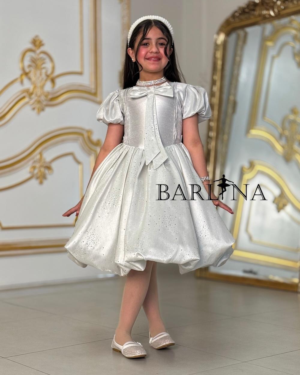 Elegant girl's dress with a bow on the chest