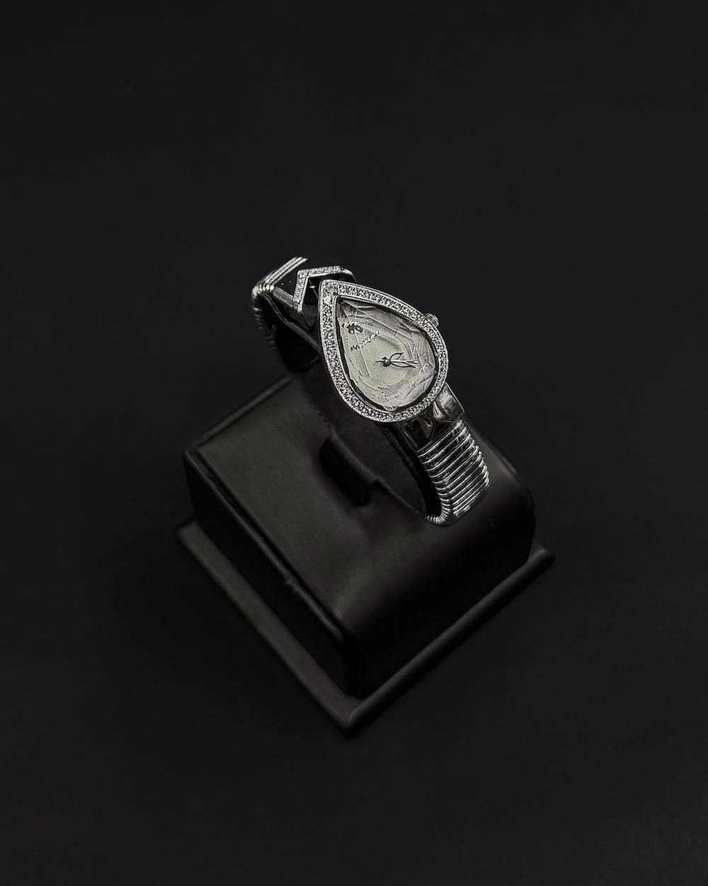 A luxurious women's watch in the shape of a teardrop