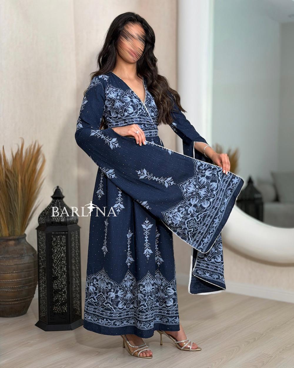 A luxurious jalabiya with delicate and elegant embroidery.