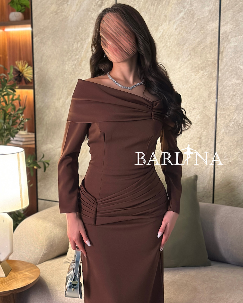 Dark brown dress with draped detailing at the waist