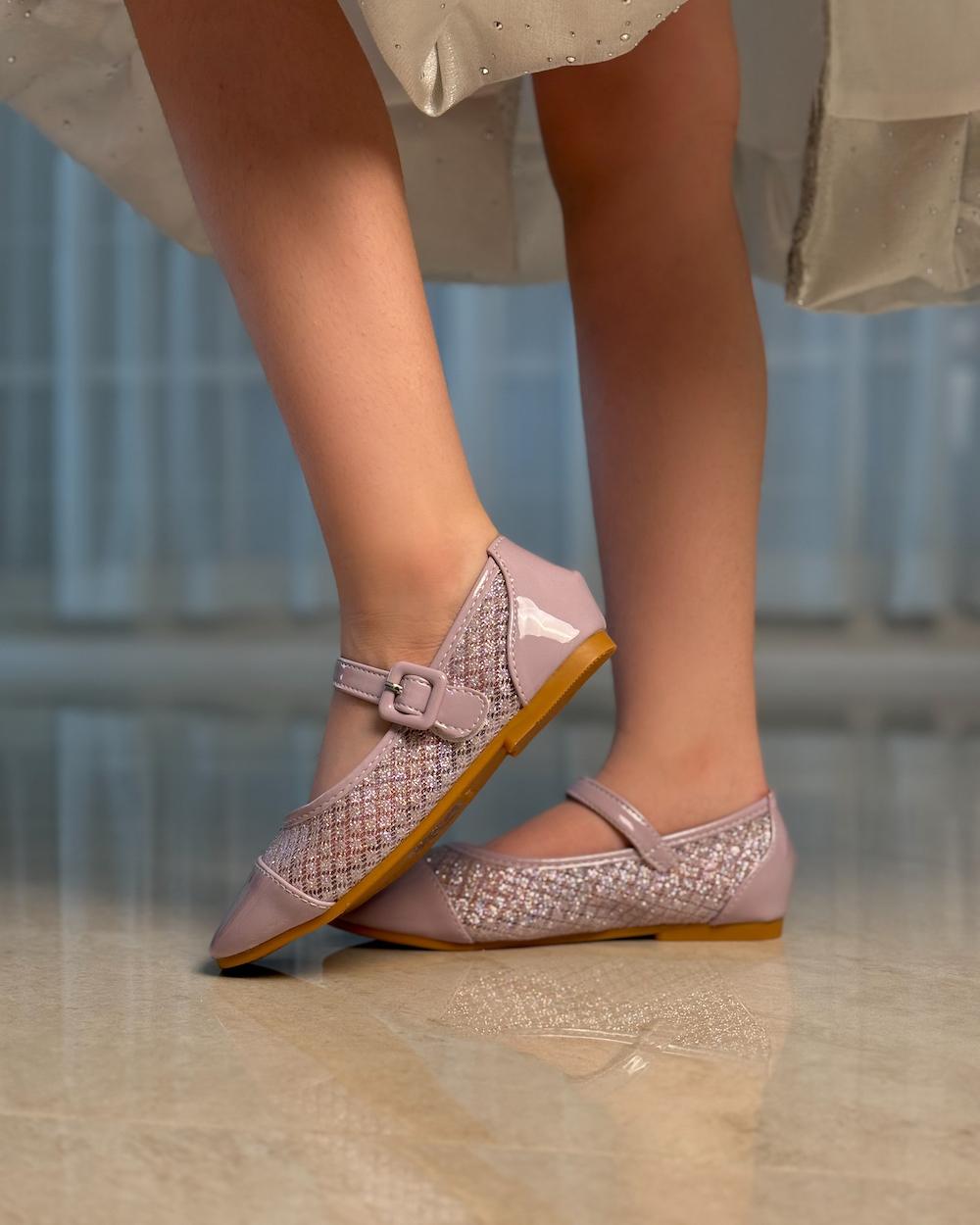 Girls' shoes with a shiny material and leather at the front