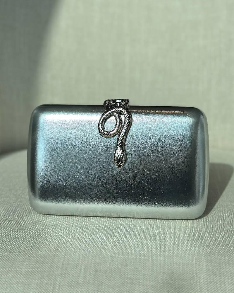 Clutch bag with metal snake lock