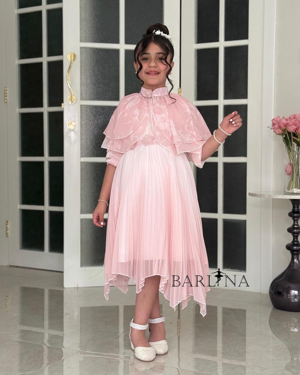 Girls' pleated dress with a floral overlay