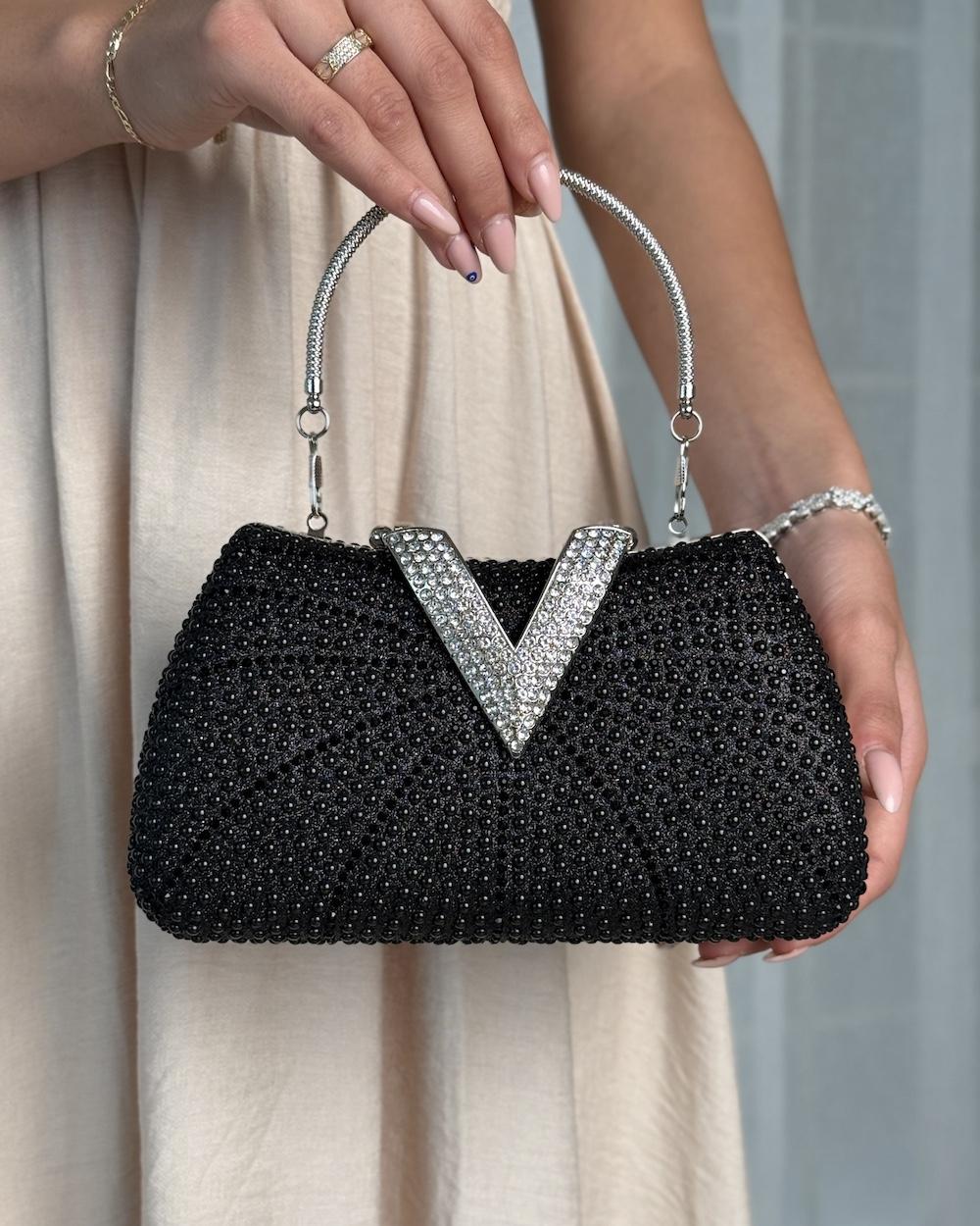 A luxurious occasion bag adorned with pearls and rhinestones