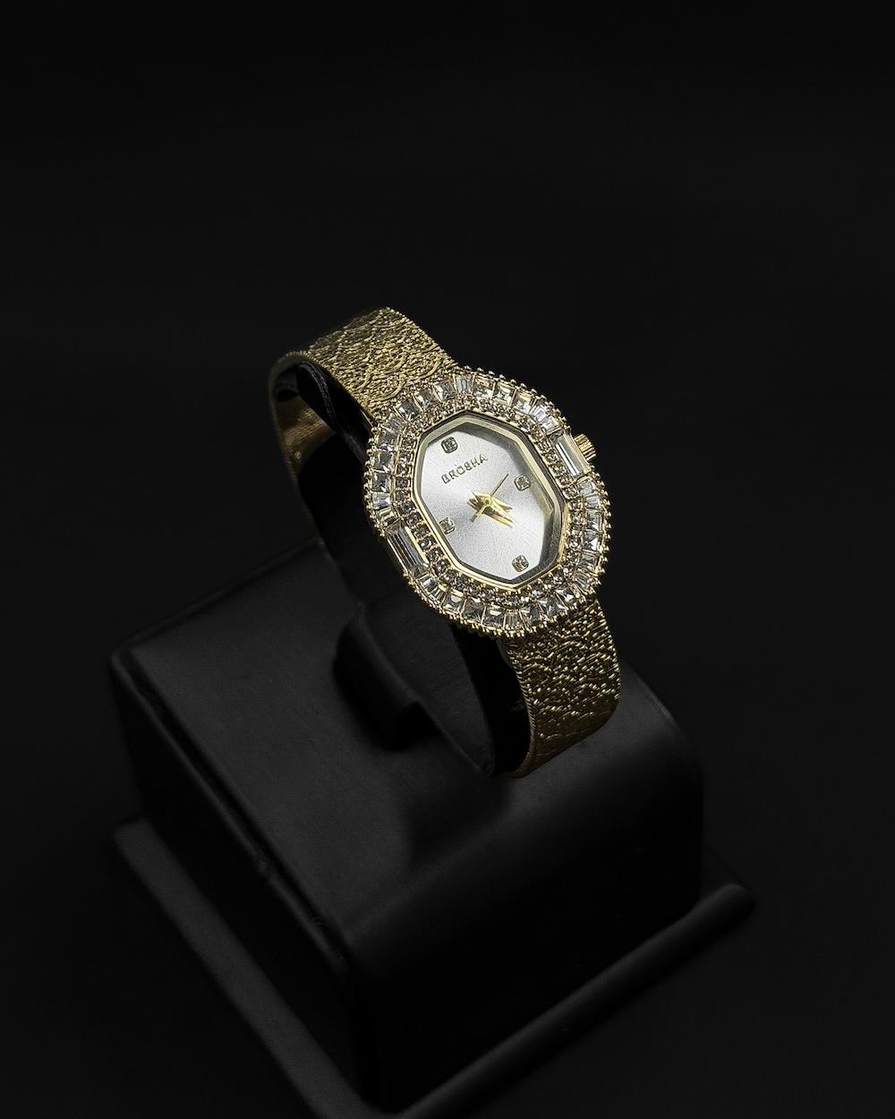 Womens watch with an oval bezel fully studded