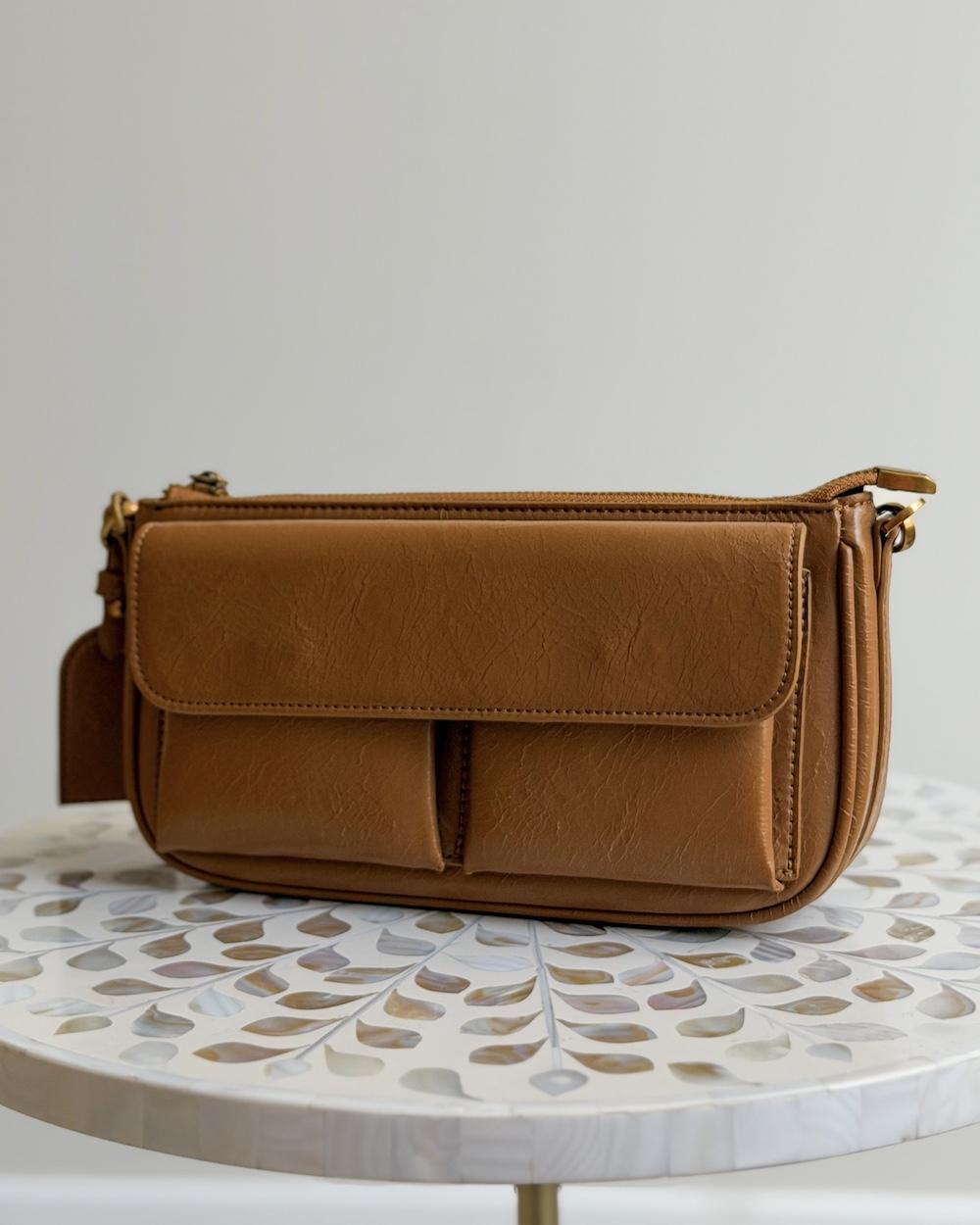 A soft handbag with a practical design and front pockets.