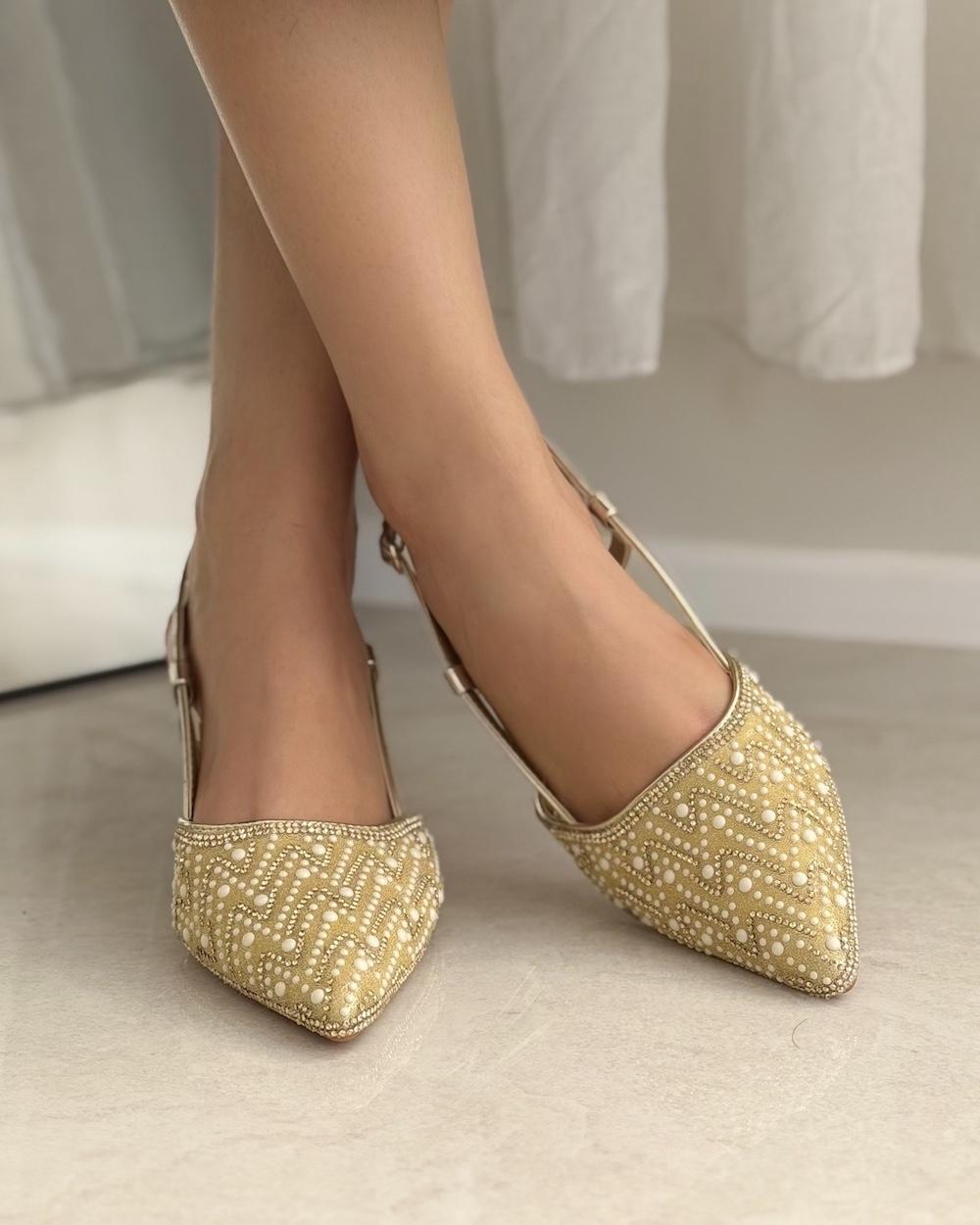 Elegant women's heels adorned with a pearl bead pattern
