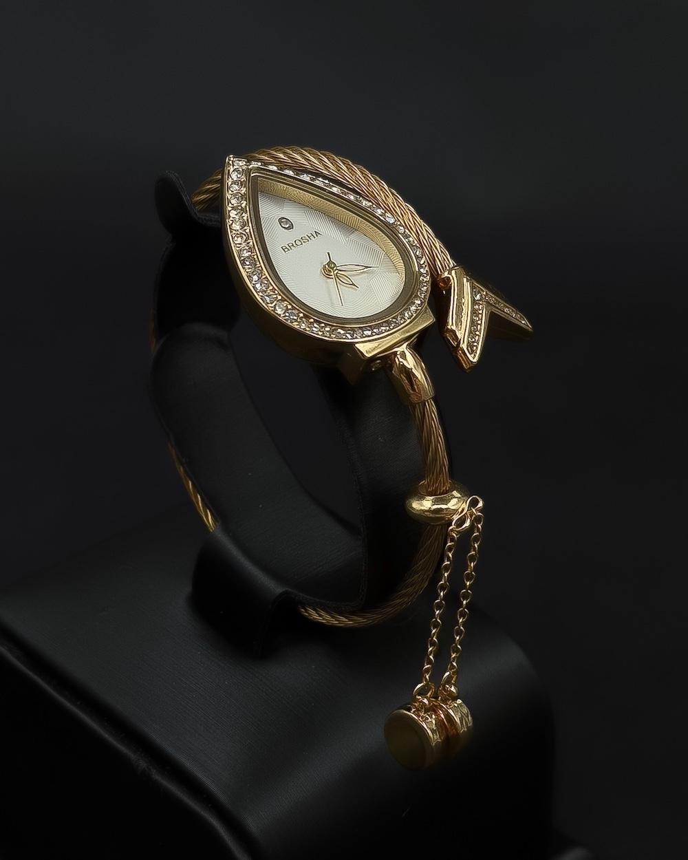 Teardrop-shaped wristwatch adorned with sparkling crystals