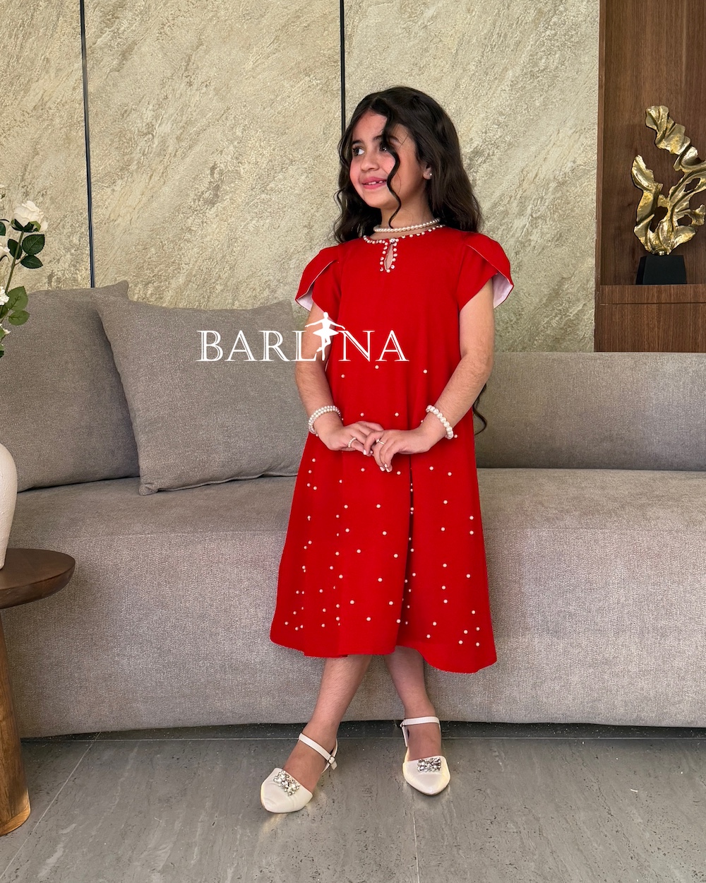 Girls red dress decorated with pearls