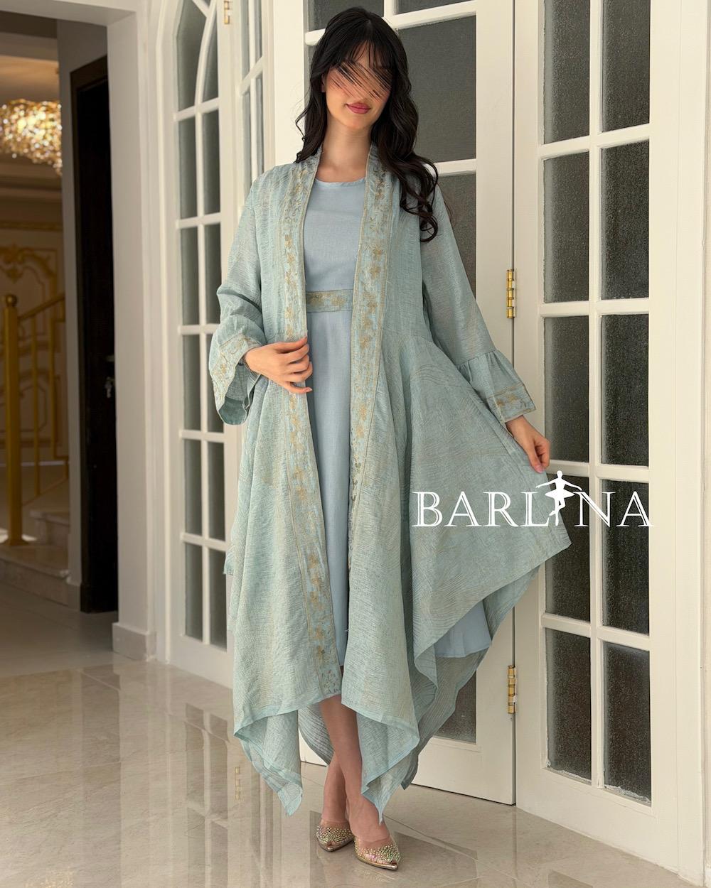 A soft jalabiya with an outer abaya featuring a gold pattern