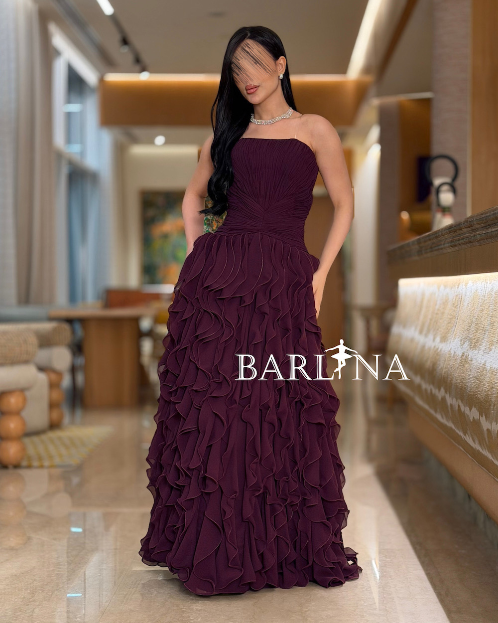Purple evening dress decorated with layers of ruffles