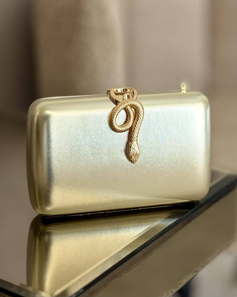 Clutch bag with metal snake lock