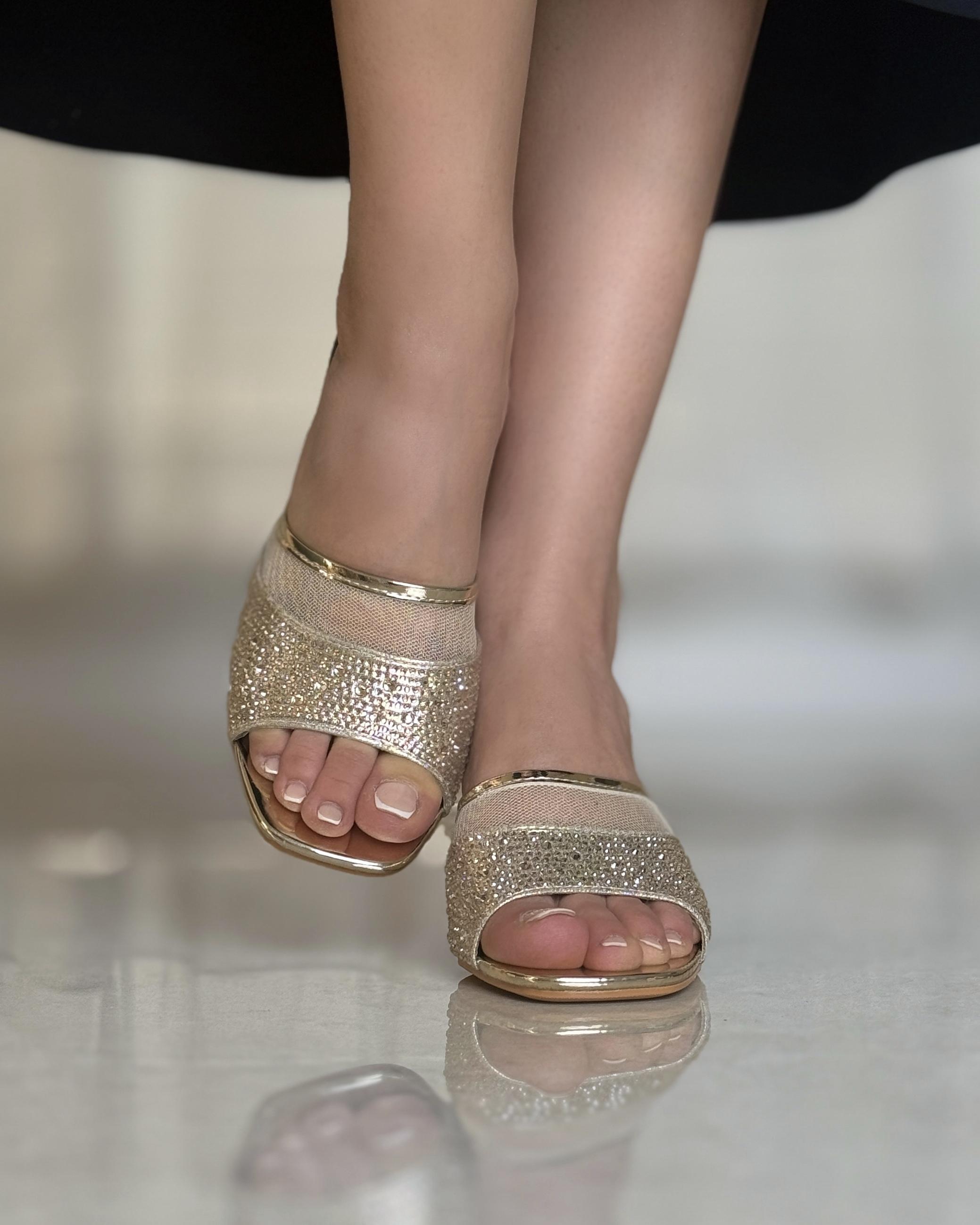 Wide heel studded with sparkling gems
