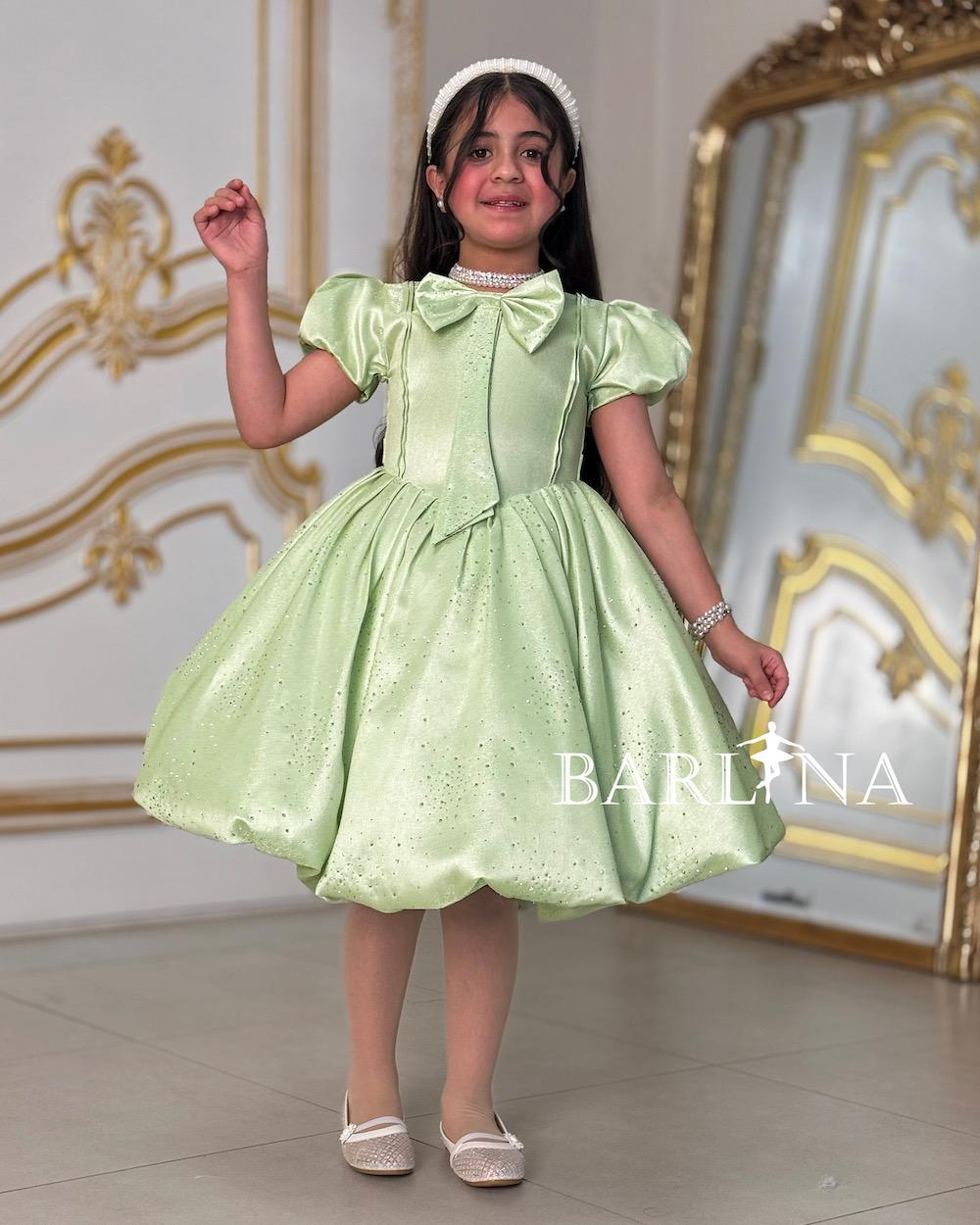 Elegant girl's dress with a bow on the chest