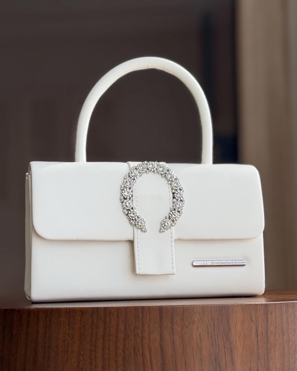 Handbag decorated with crystal details