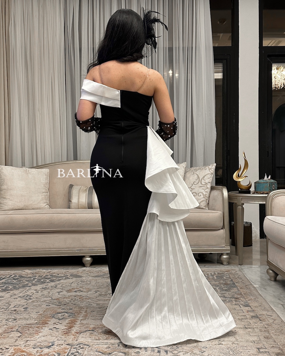 Black dress with white details and studded sleeves