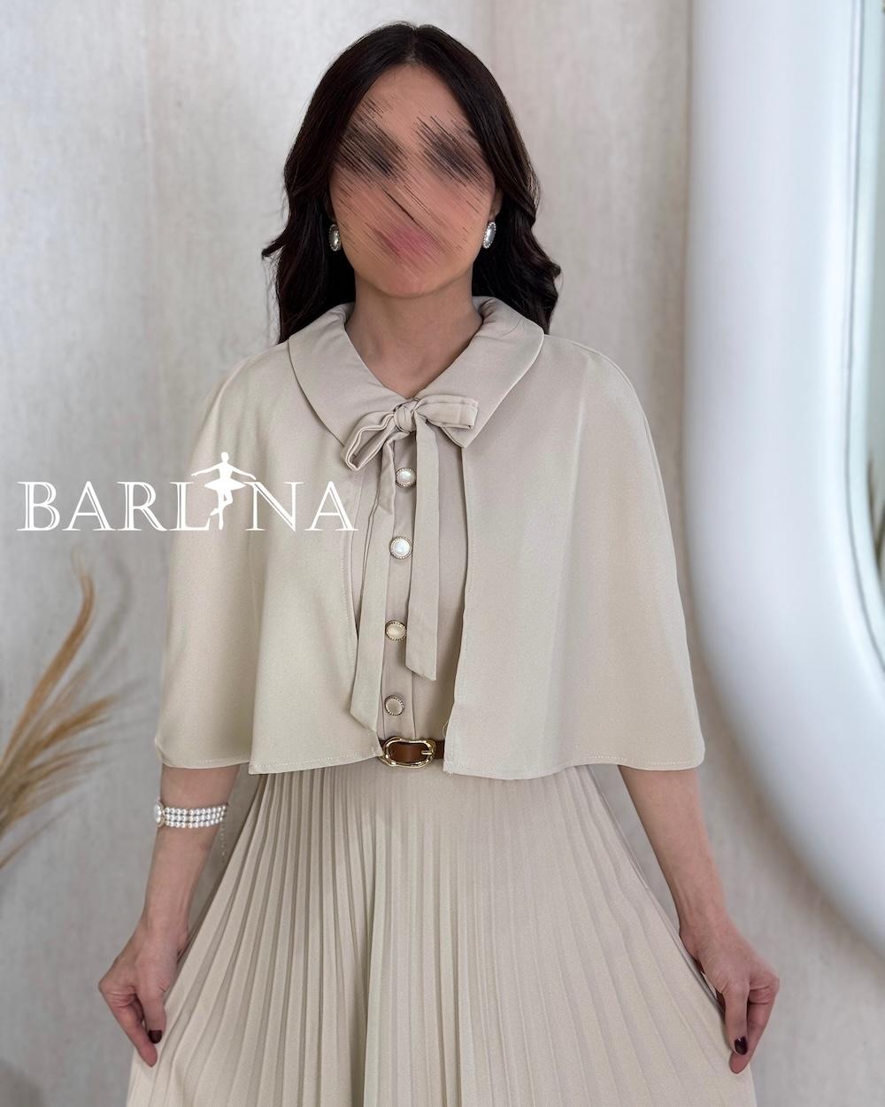 Beige pleated dress with a short flowing cape