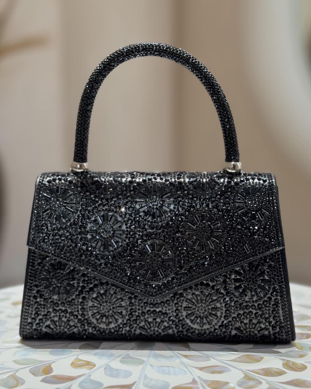A luxurious handbag covered in crystal beads