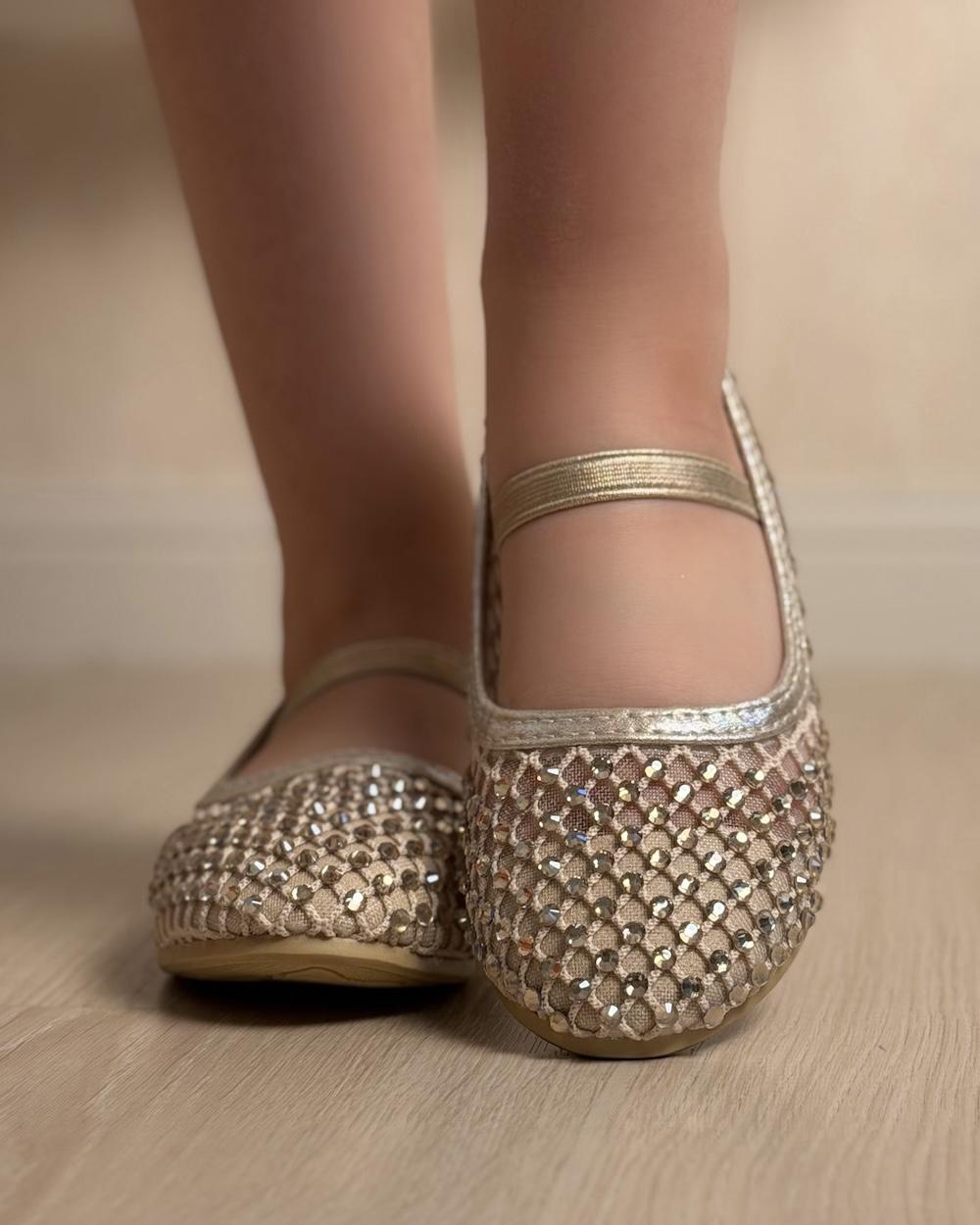 Soft girls' shoes adorned with sparkling crystals