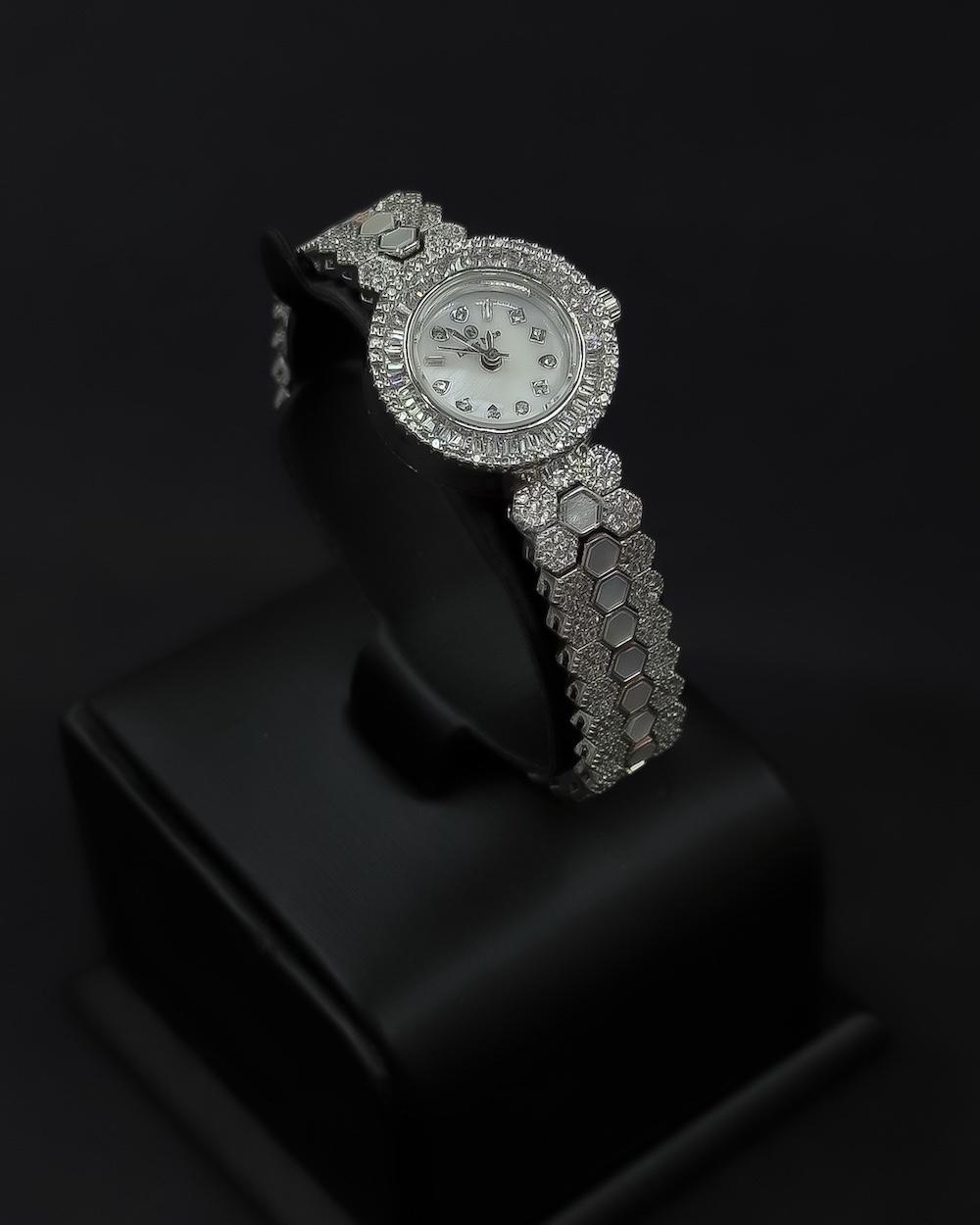 A luxurious women's watch adorned with sparkling stones