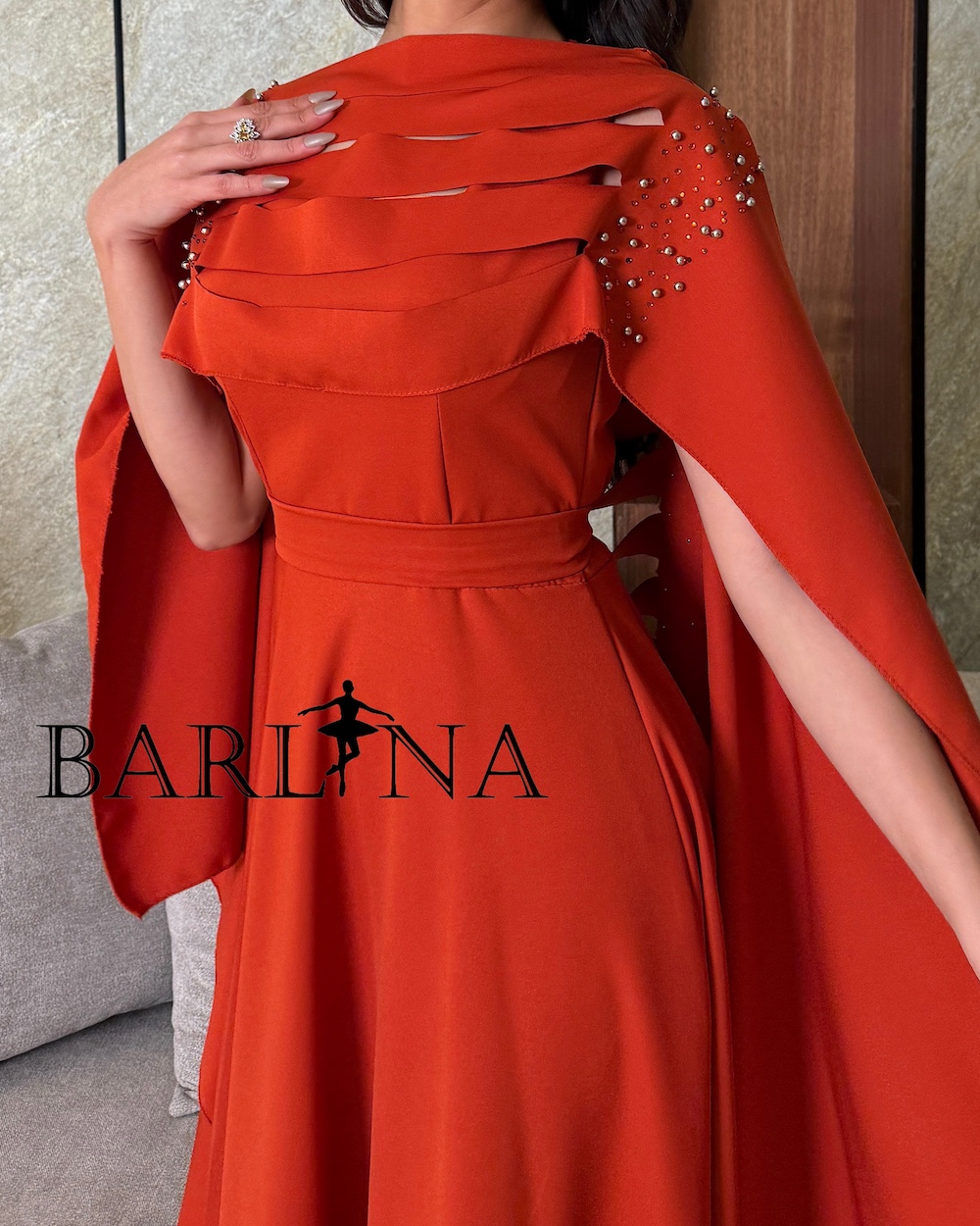 Dark orange dress with a distinctive back design