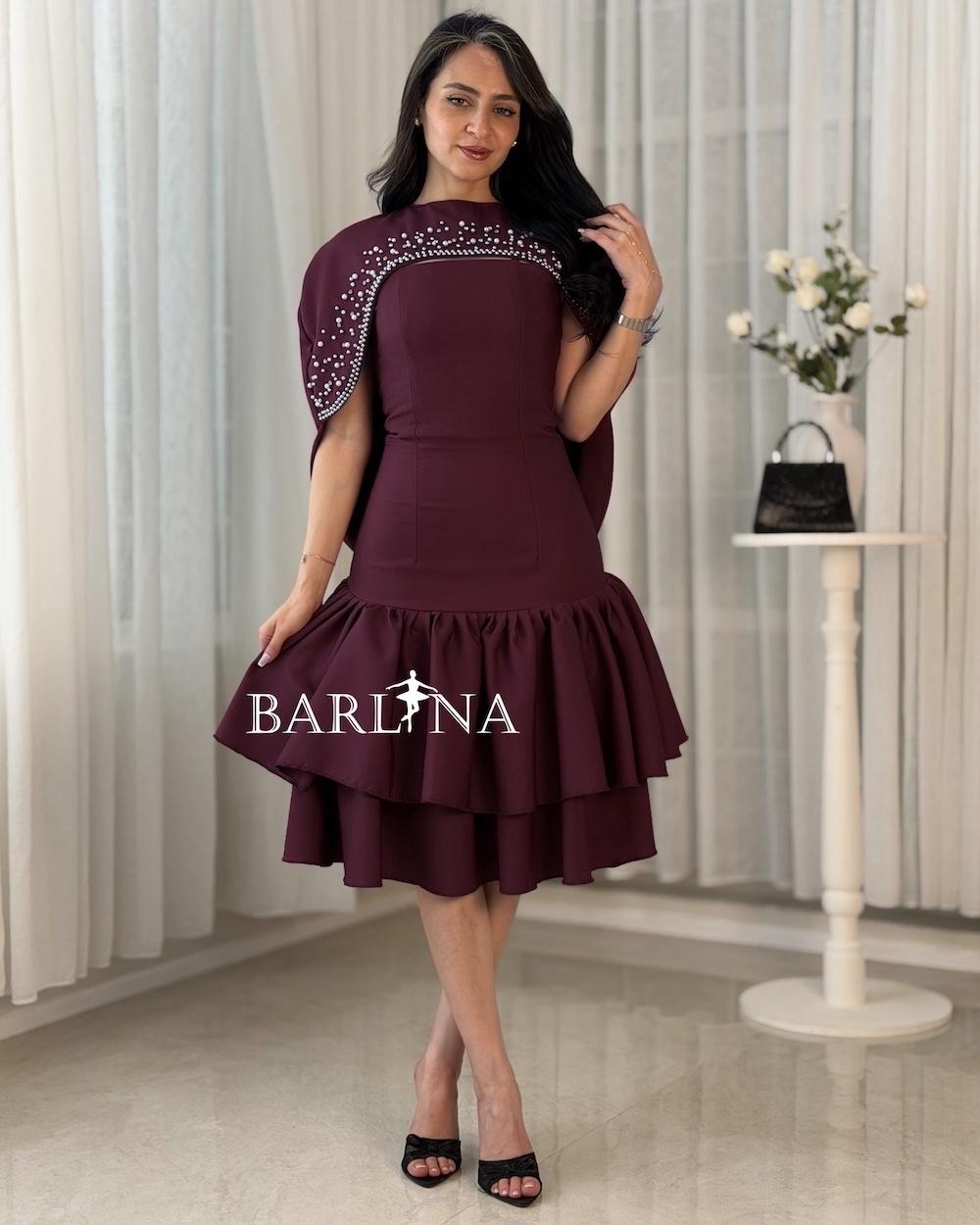 A short dress adorned with pearl details