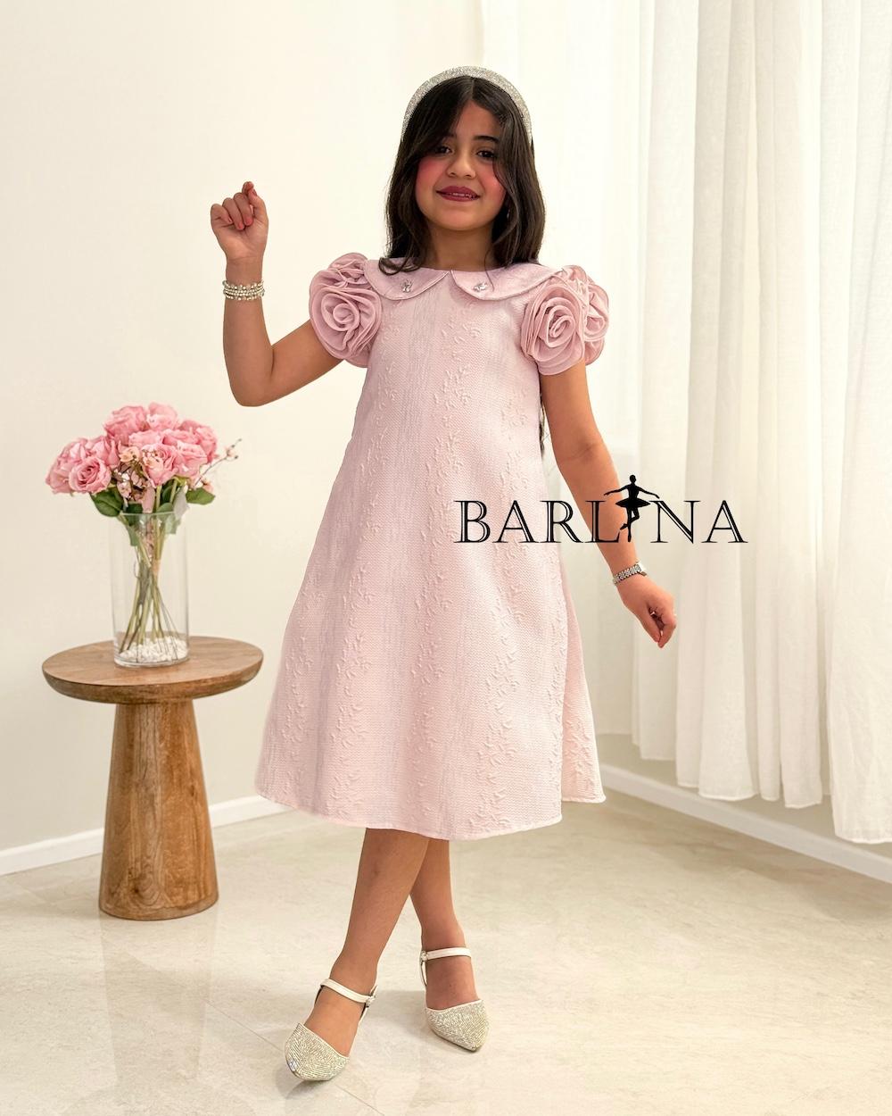 A girl's dress with a wide cut and prominent roses