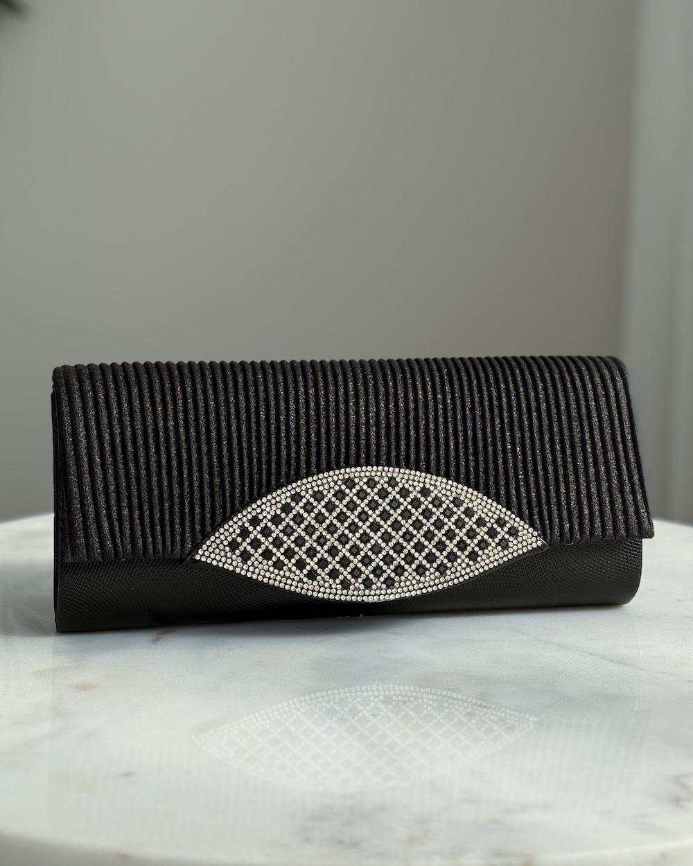 A bag decorated with a front panel made of rhinestones