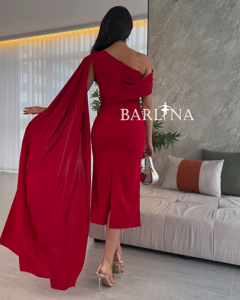 Red midi dress with extended shoulders as a scarf